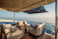 Luxurious 2025 Absolute 52 FLY yacht deck with elegant seating and ocean view.