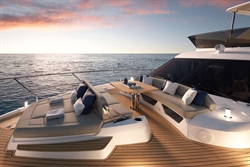 Luxurious 2025 Absolute 52 FLY yacht deck at sunset, featuring elegant seating and ocean views.
