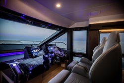 Luxurious cockpit of 2025 Absolute 52 FLY yacht with advanced navigation systems.